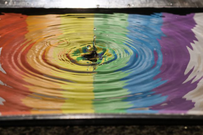 rainbow flag colours in water